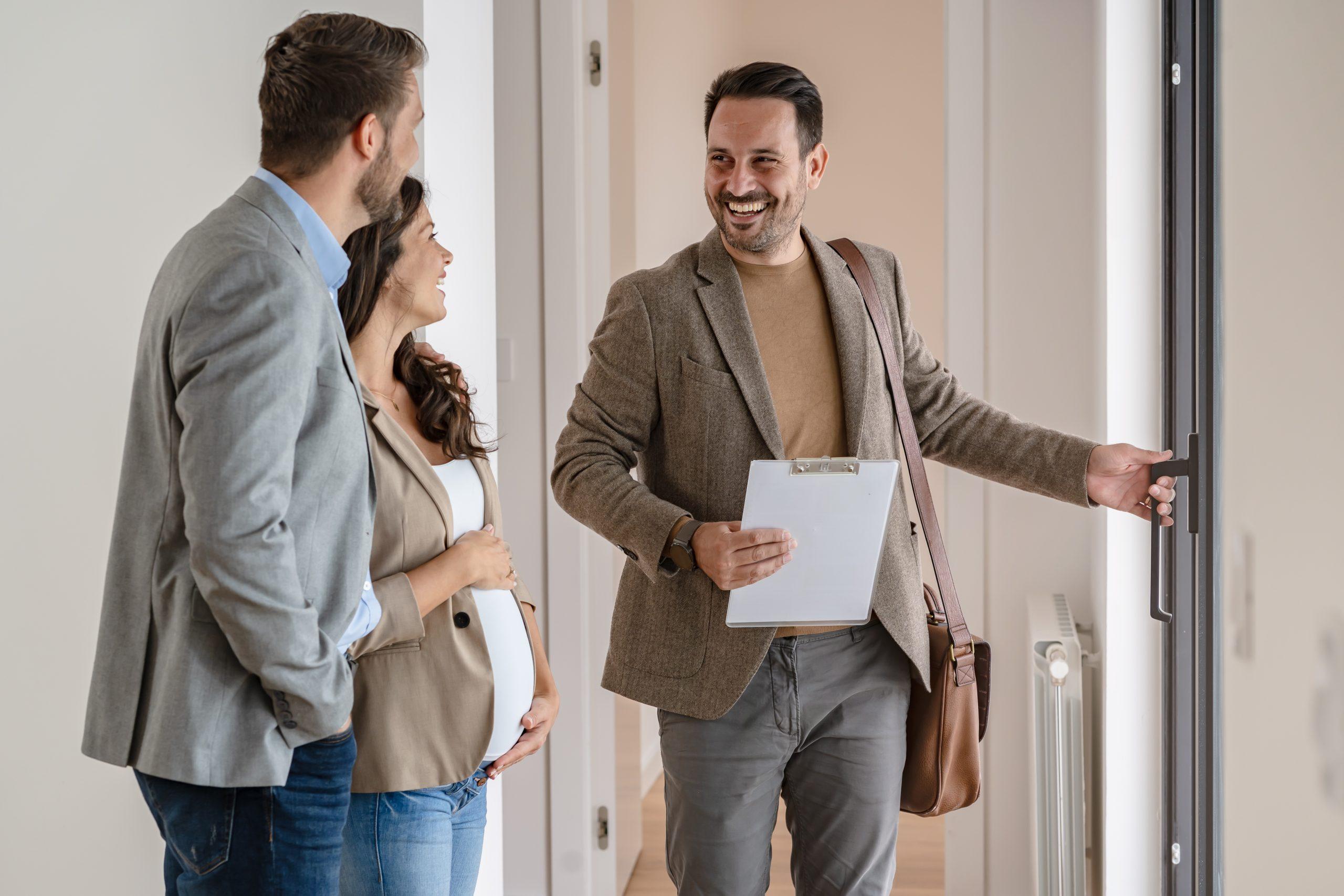 A young couple with a real-estate agent