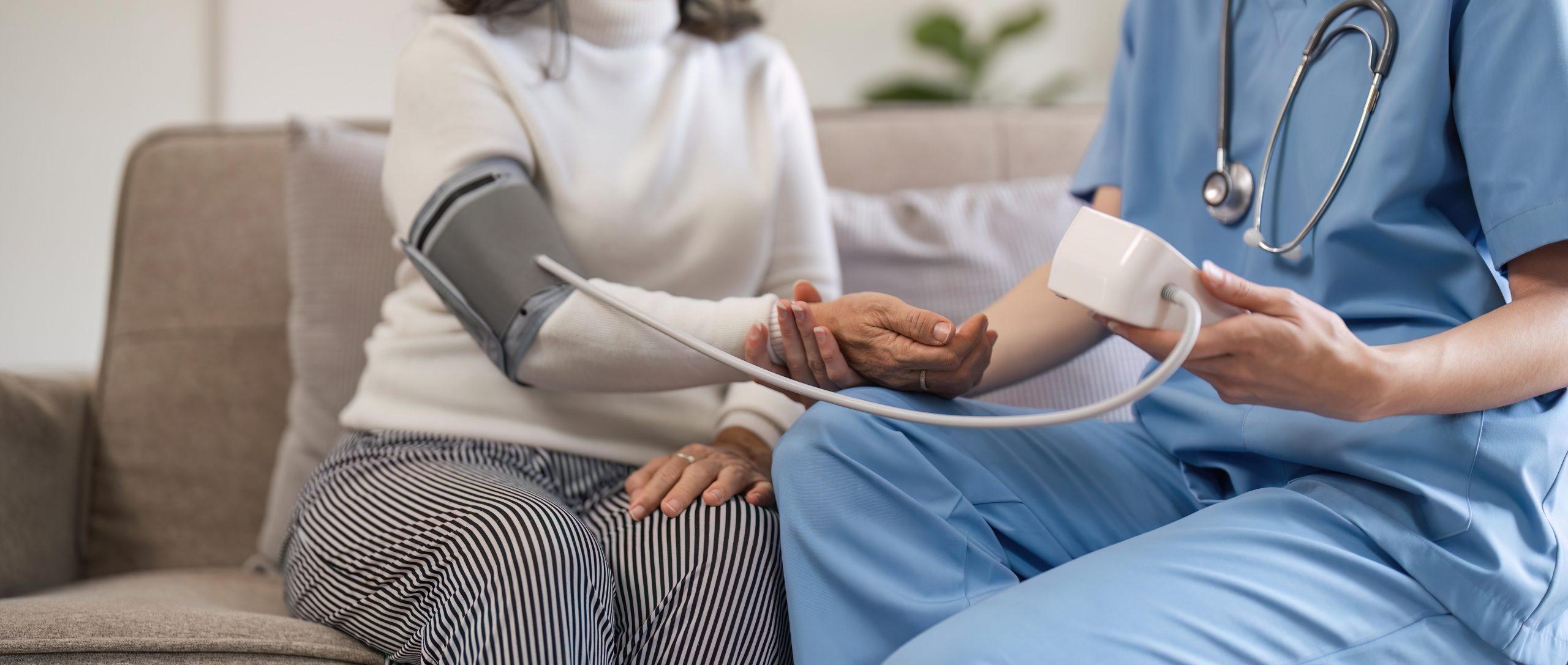 nurse doctor using digital tonometer